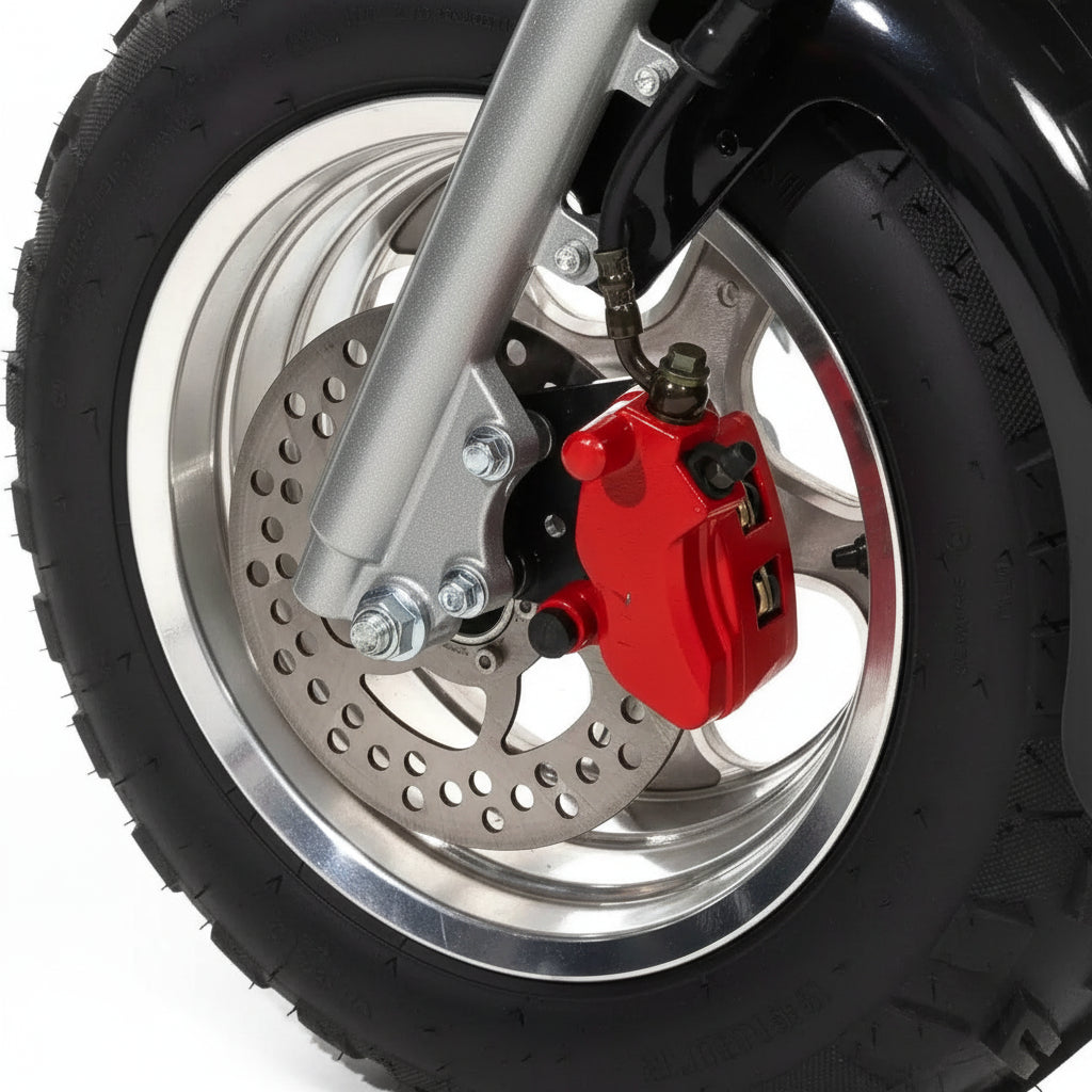 Close-up of a motorcycle wheel with red brake