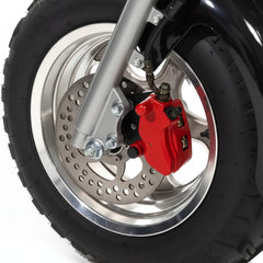 Close-up of a motorcycle wheel with red brake