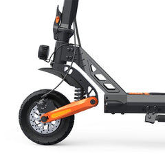 Close-up of a scooter's suspension system with orange and black components