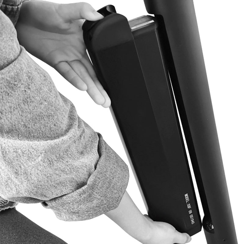 Person adjusting a Folding Electric Scooter