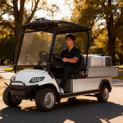 Person sitting in a white golf cart