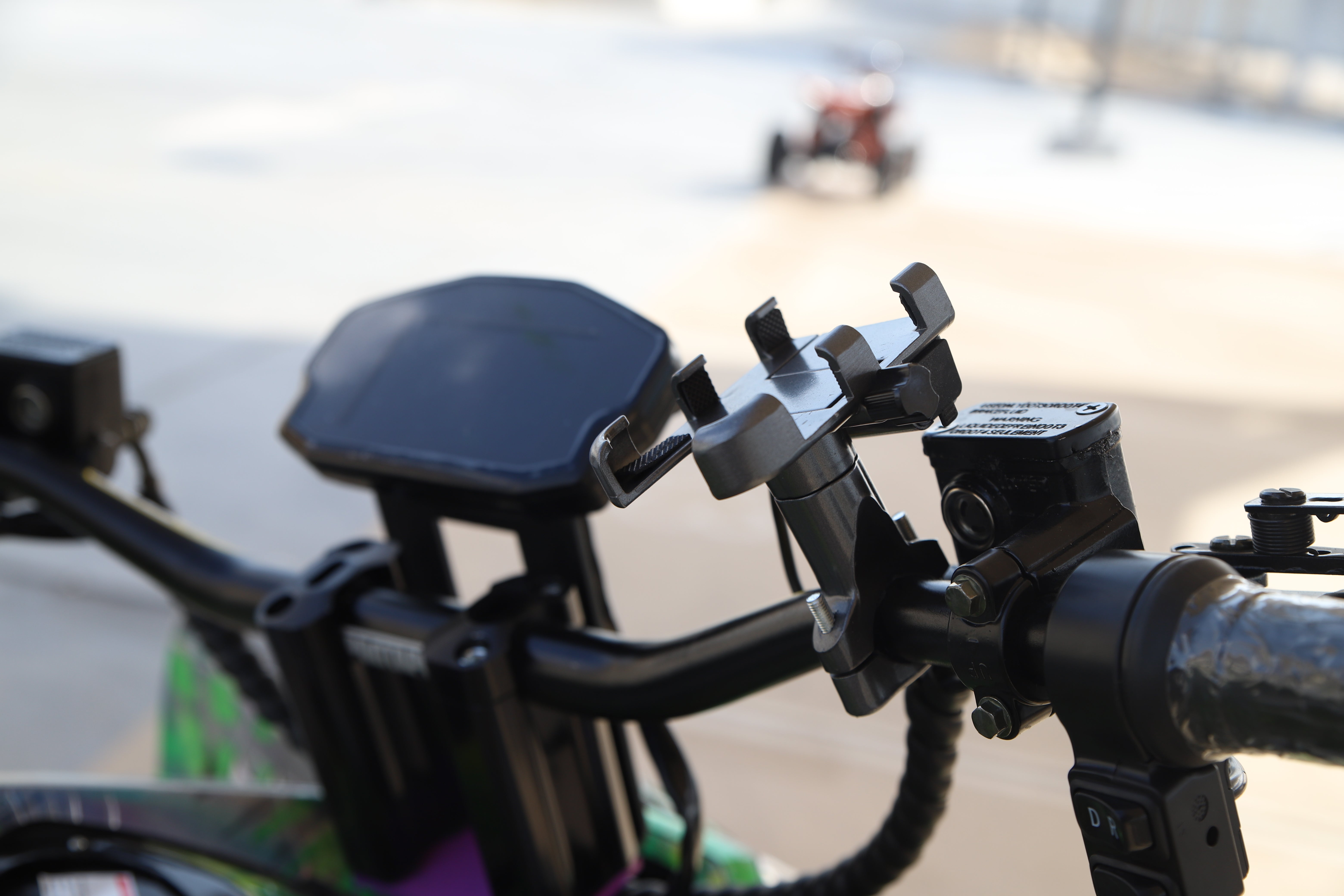 Close-up of a bike handlebar with a Mobile Phone Holder