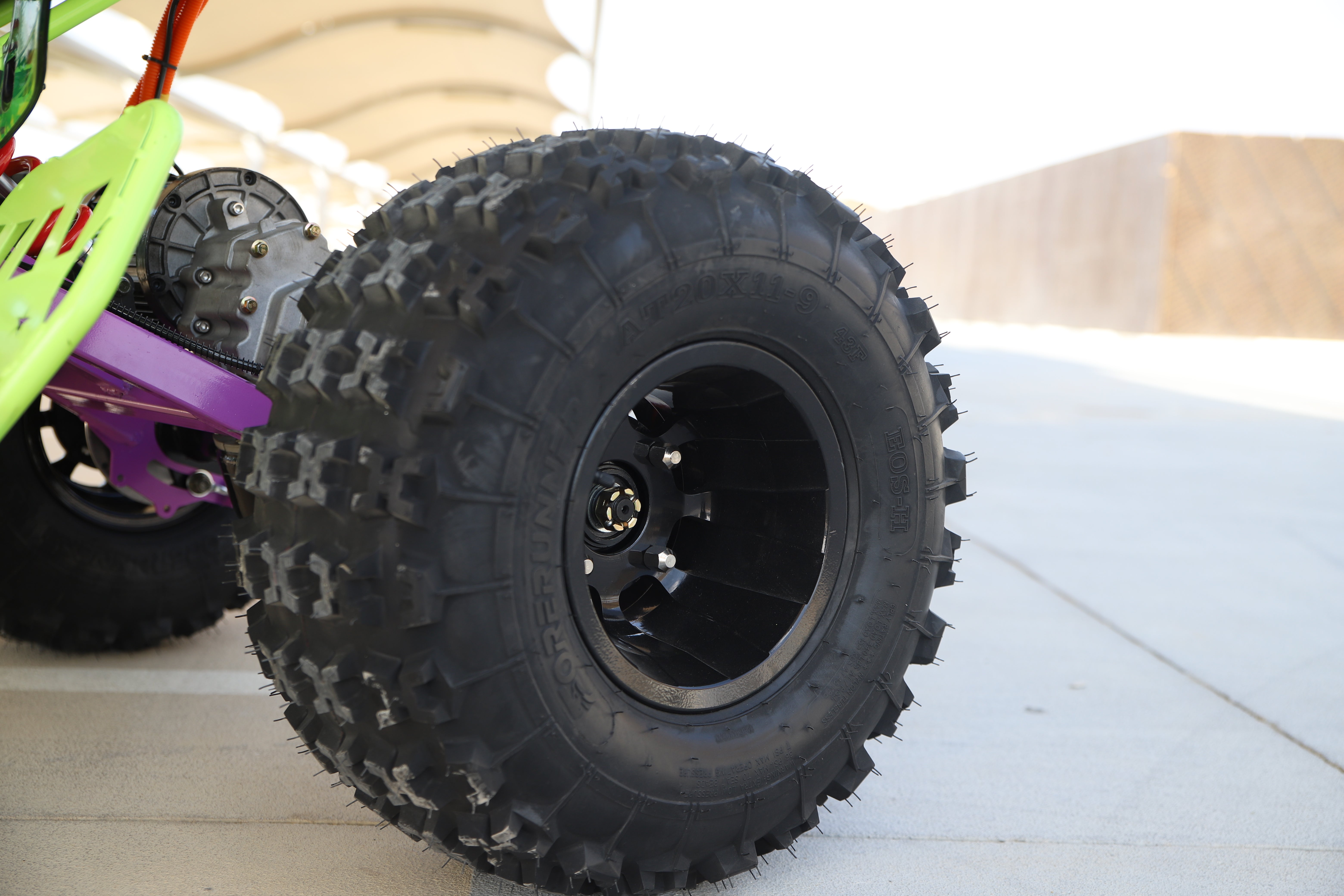 Close-up of off-road tire on an Electric ATV Atom 72 V Quad Bike