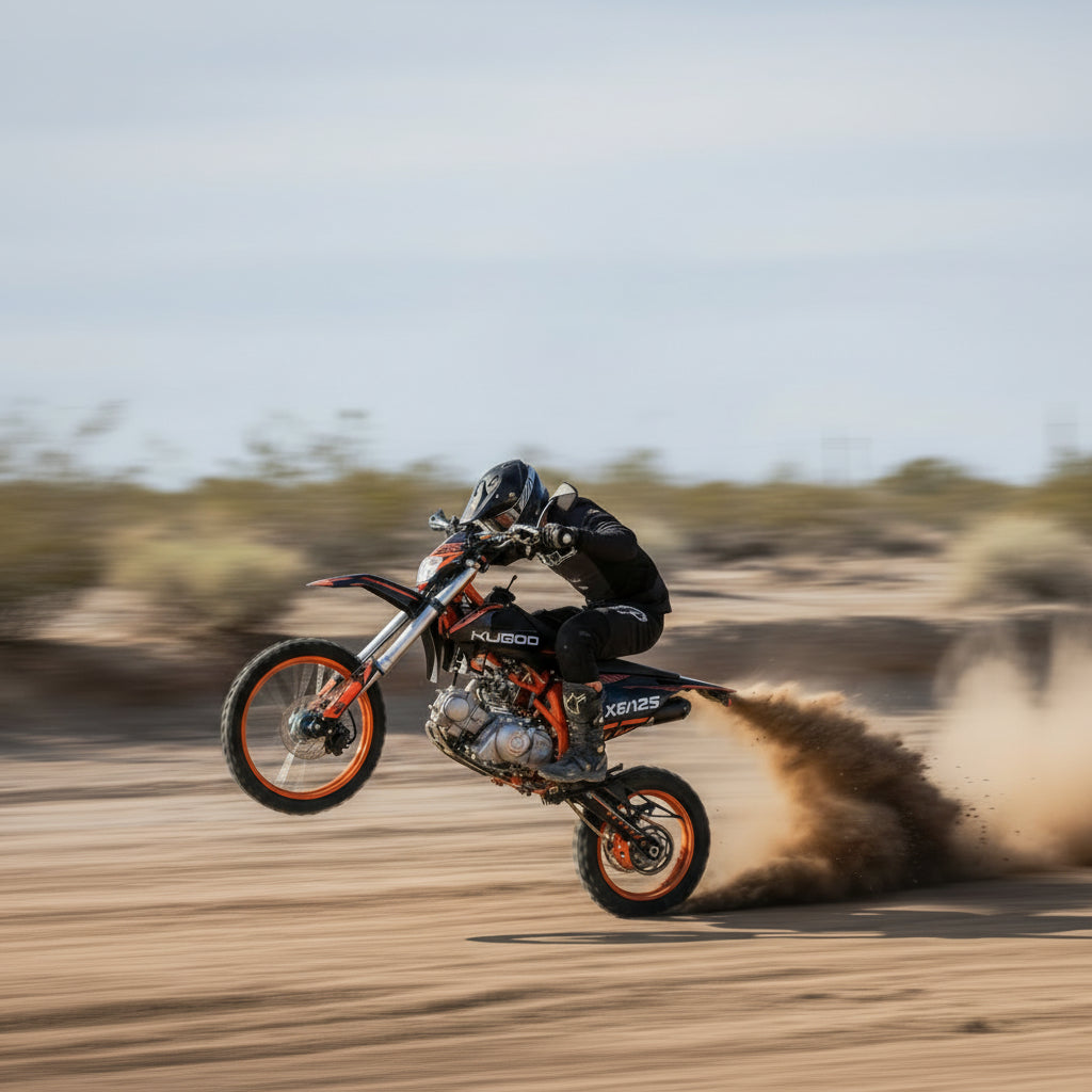 Person riding a dirt bike on a sandy track