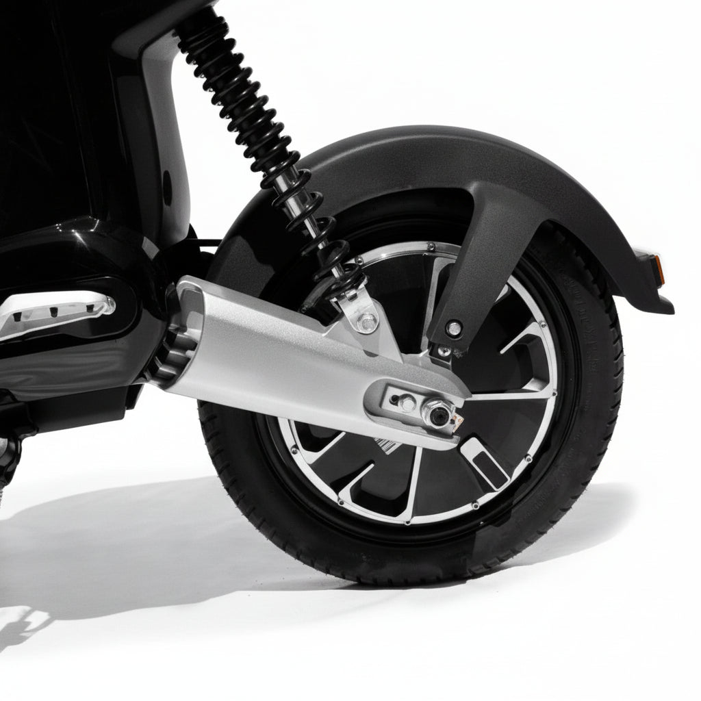 Close-up of a motorcycle wheel with exhaust