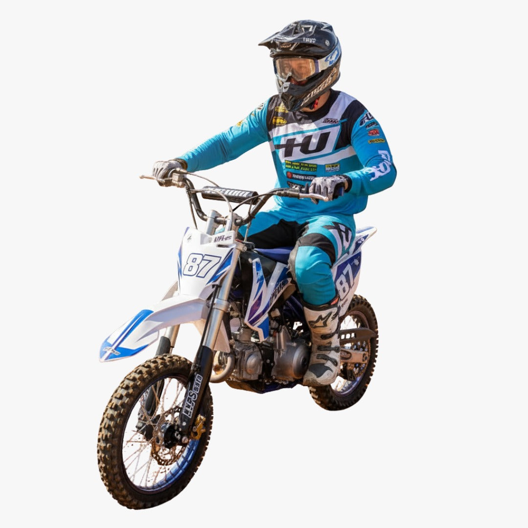 Person on a dirt bike of 125 CC Phantom Dirt Cross Bike off-roading