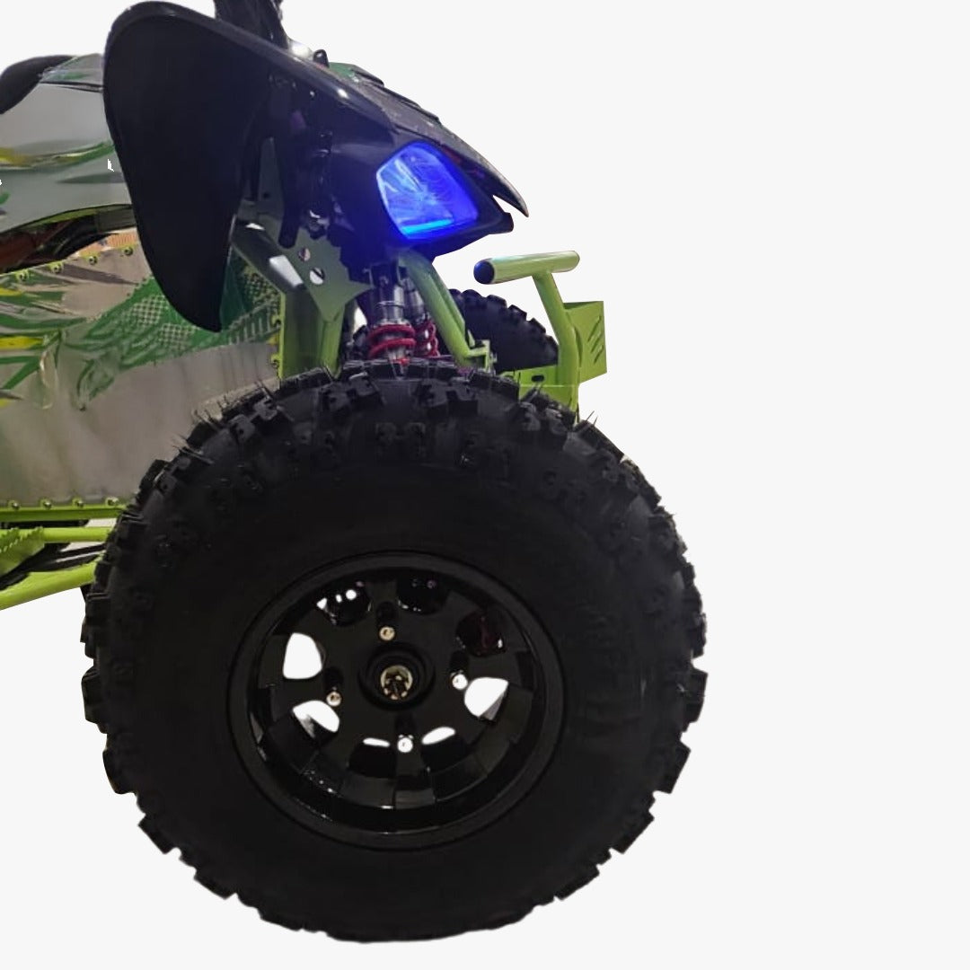 Close-up of an Electric ATV Atom 72 V Quad Bike with a large black tire