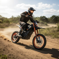Person riding a dirt bike on a dirt road