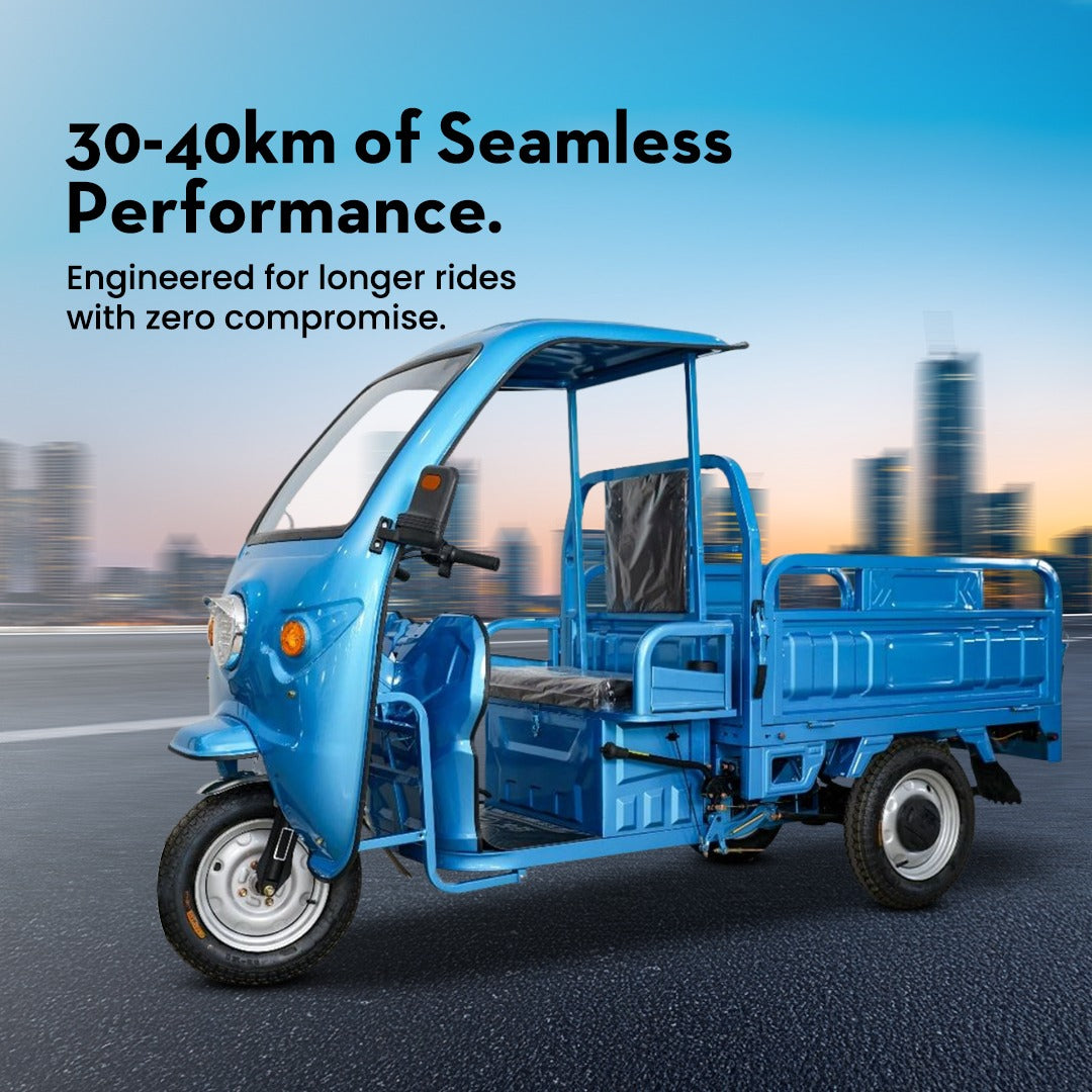Blue three-wheeled vehicle on a road with a cityscape