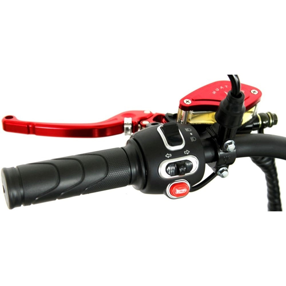 Close-up of a motorcycle handlebar with red brake lever