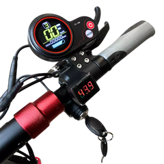 Digital display on a bicycle handlebar with red accents