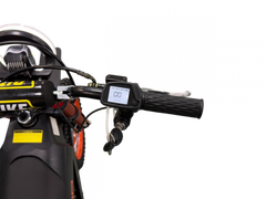 Close-up of a motorcycle handlebar with a control panel