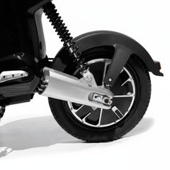 Close-up of a motorcycle wheel with exhaust 