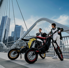 2 guys standing next to Titaone Viper S Electric Dirt Bike High Performance 