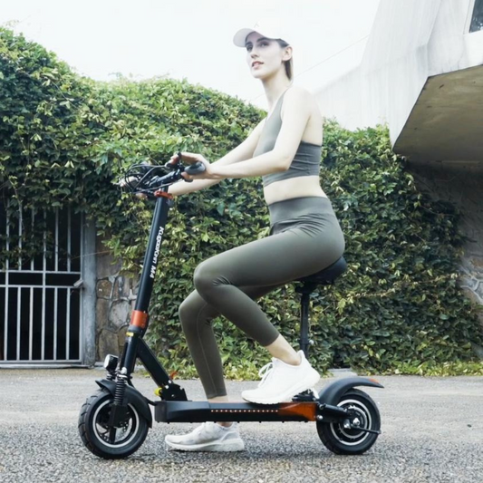 Woman riding Kugoo Kirin M4 Pro Folding Electric Scooter 48 V for Adults With Seat With Exclusive Warranty