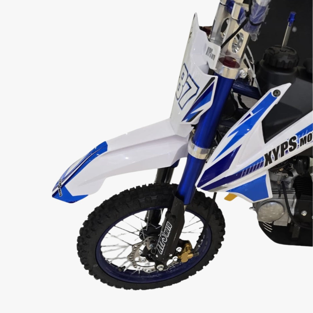 Close-up of a dirt bike with blue and white design