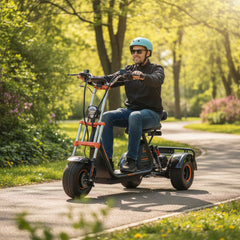 Man riding a three-wheeled electric scooter in a park