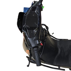 Close-up of a black motorcycle seat and handlebars