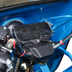 Close-up of a blue motorcycle with an LCD Display on the handlebars.