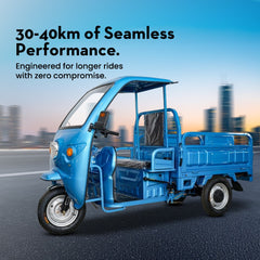 Blue three-wheeled vehicle on a road with a cityscape