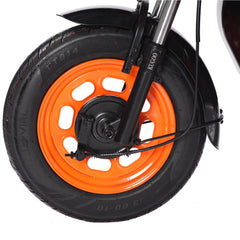 Close-up of a wheel with an orange rim and black tire