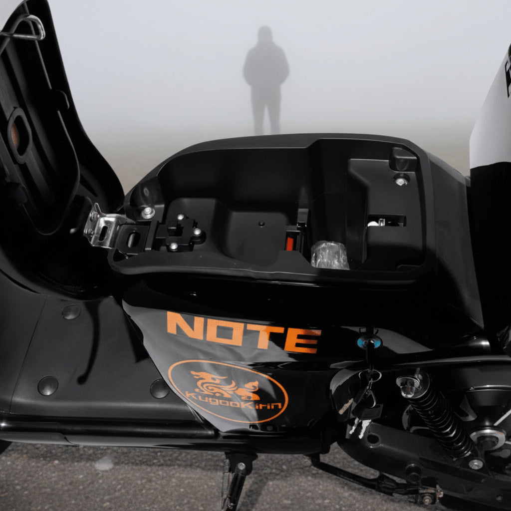 Close-up of a motorcycle battery under seats