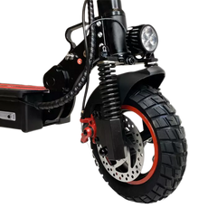 Close-up of an electric scooter's wheel and suspension system 