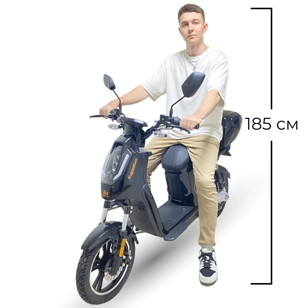 Person sitting on a motorcycle with dimensions indicated